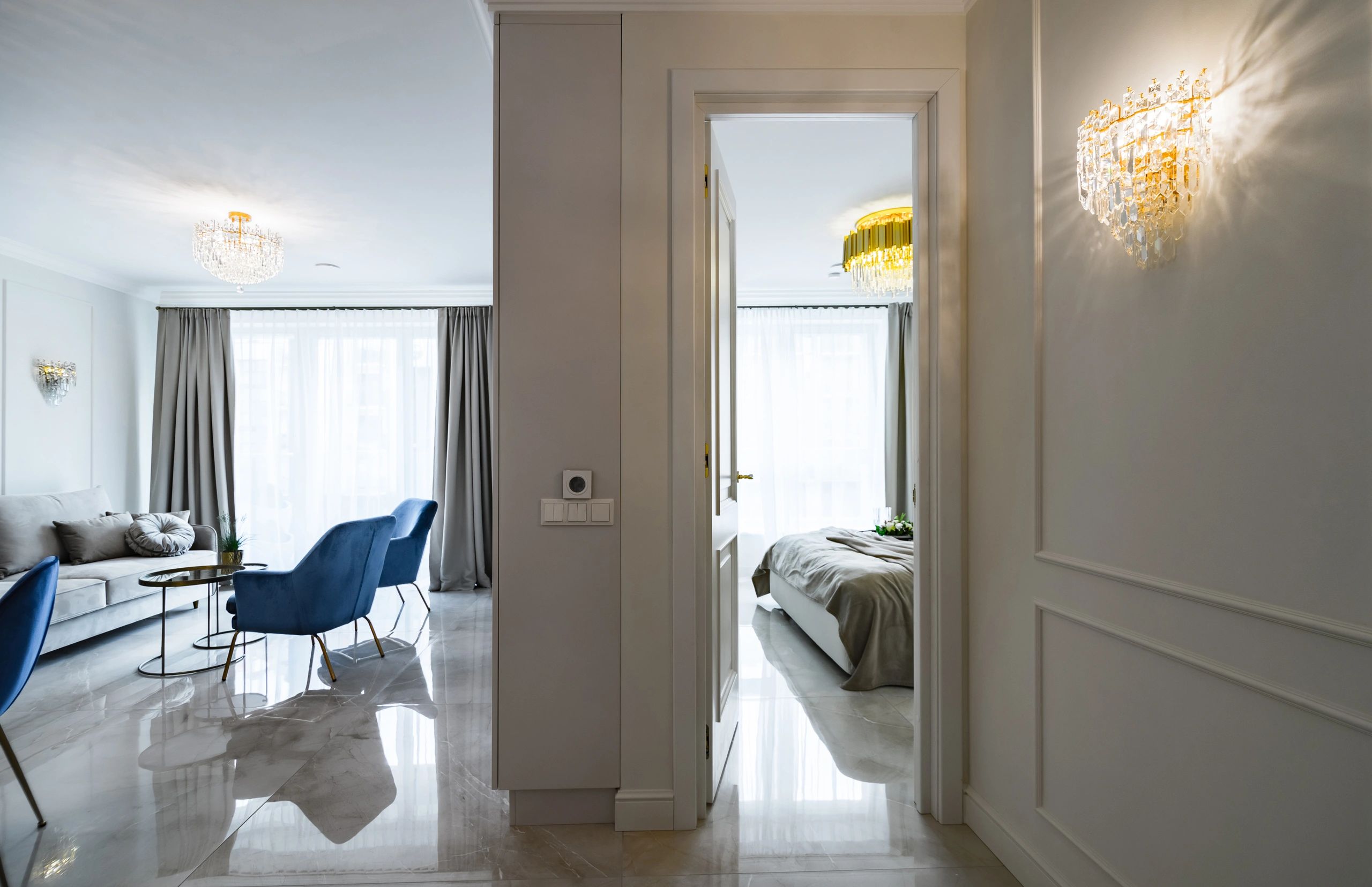 Elegant, bright home interior with a tidy living space and open doorway